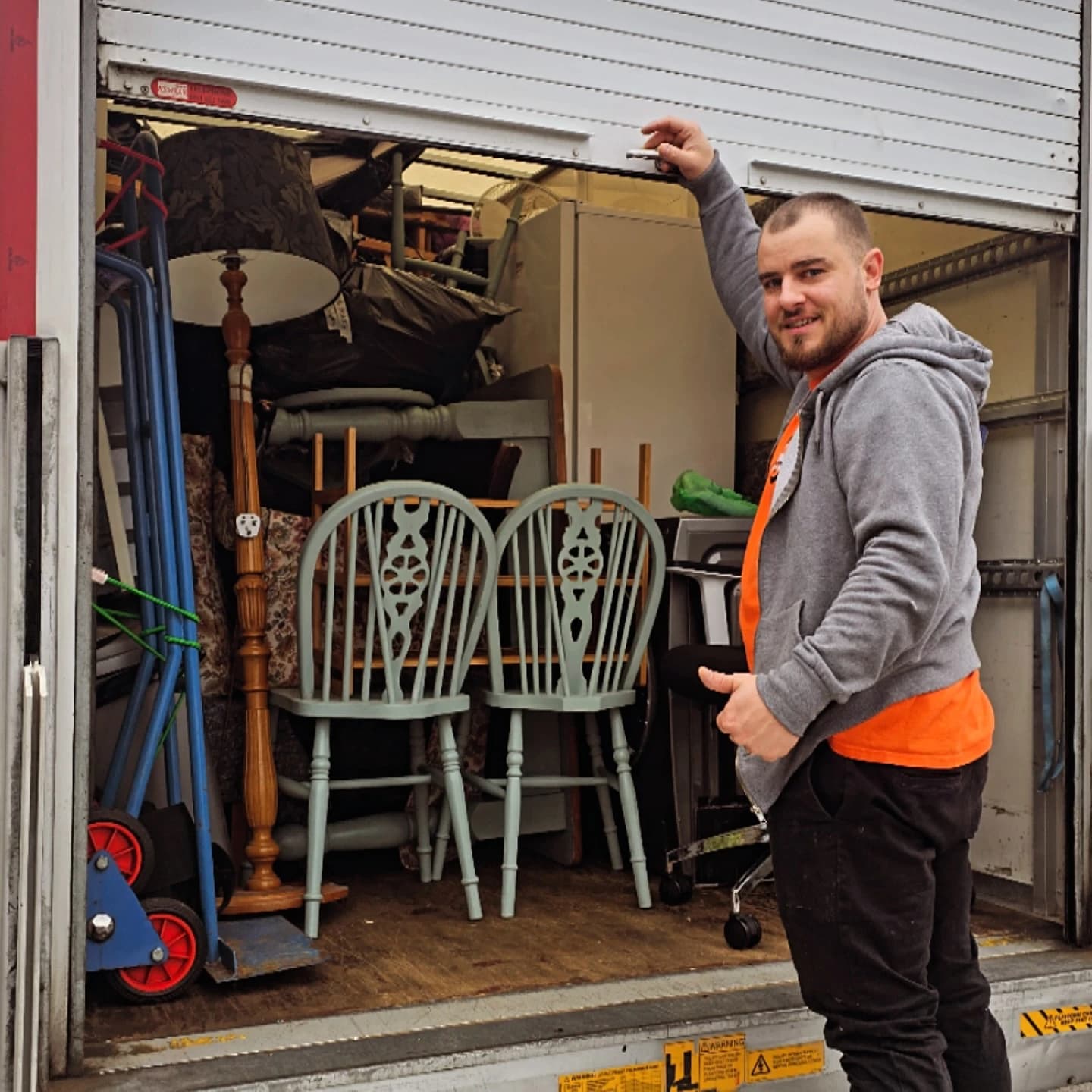 All Around Removals mover closing a fully loaded van