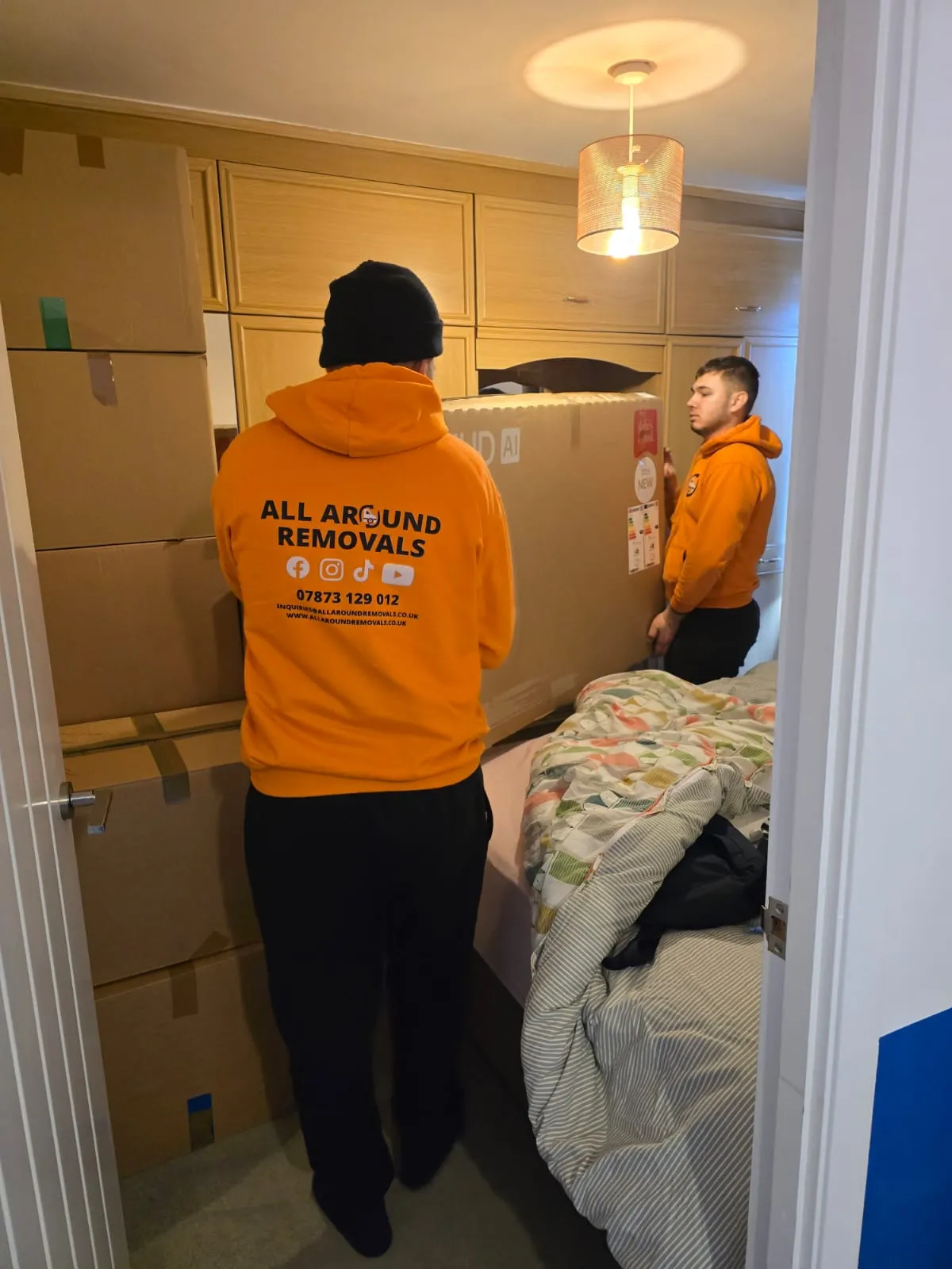 All Around Removals team moving boxes inside a home