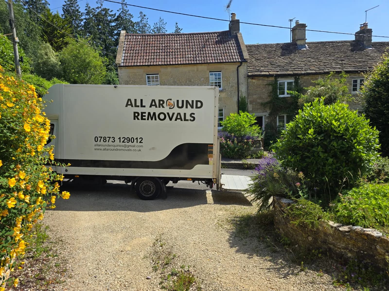 All Around Removals Luton van parked outside stone cottages